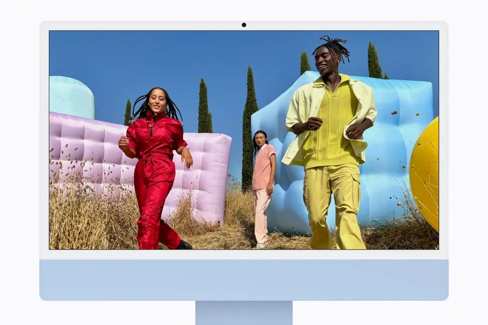 Front of a blue iMac showing a colourful photo on its 4.5K display