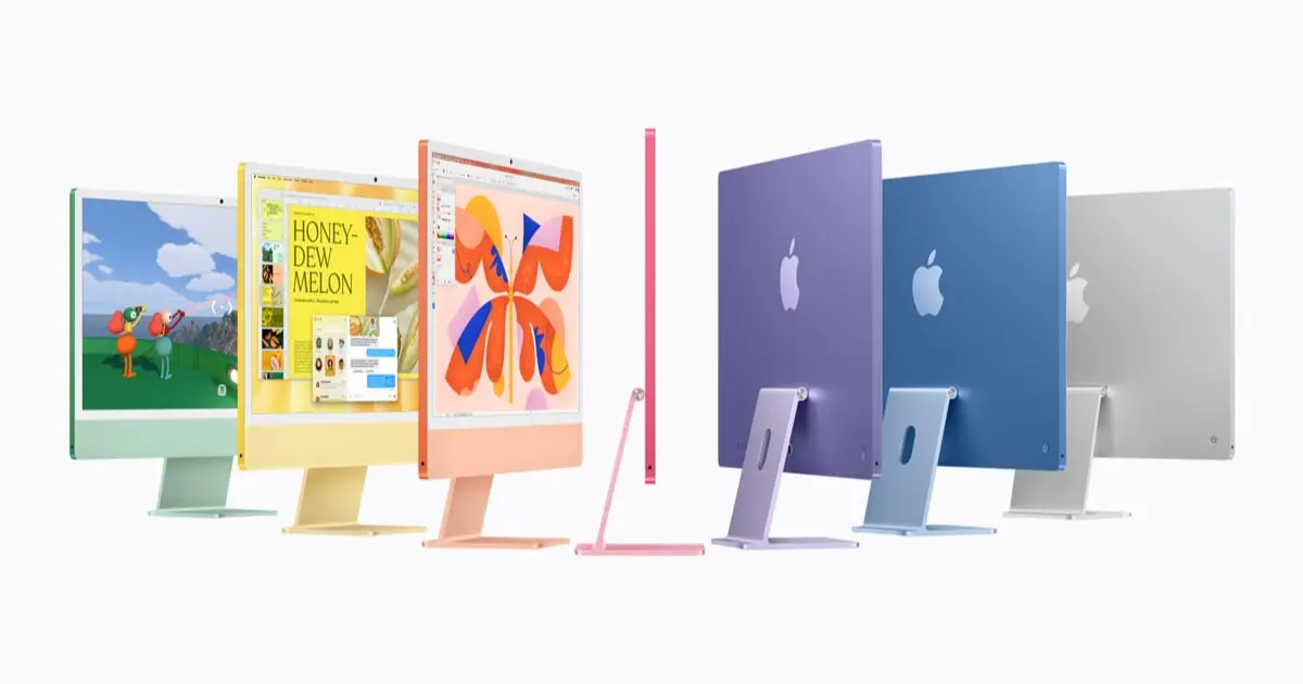 Row of 24-inch iMac computers in seven colours seen from the front and back