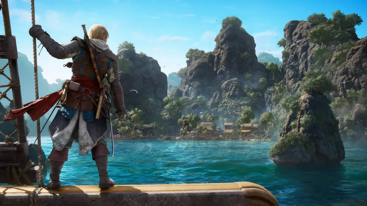 Edward Kenway on the deck of a ship looking at a tropical cove