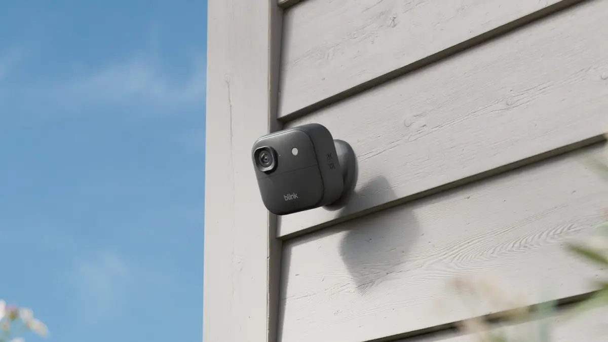 Black Blink Outdoor 2K XR+ camera mounted on a house exterior wall