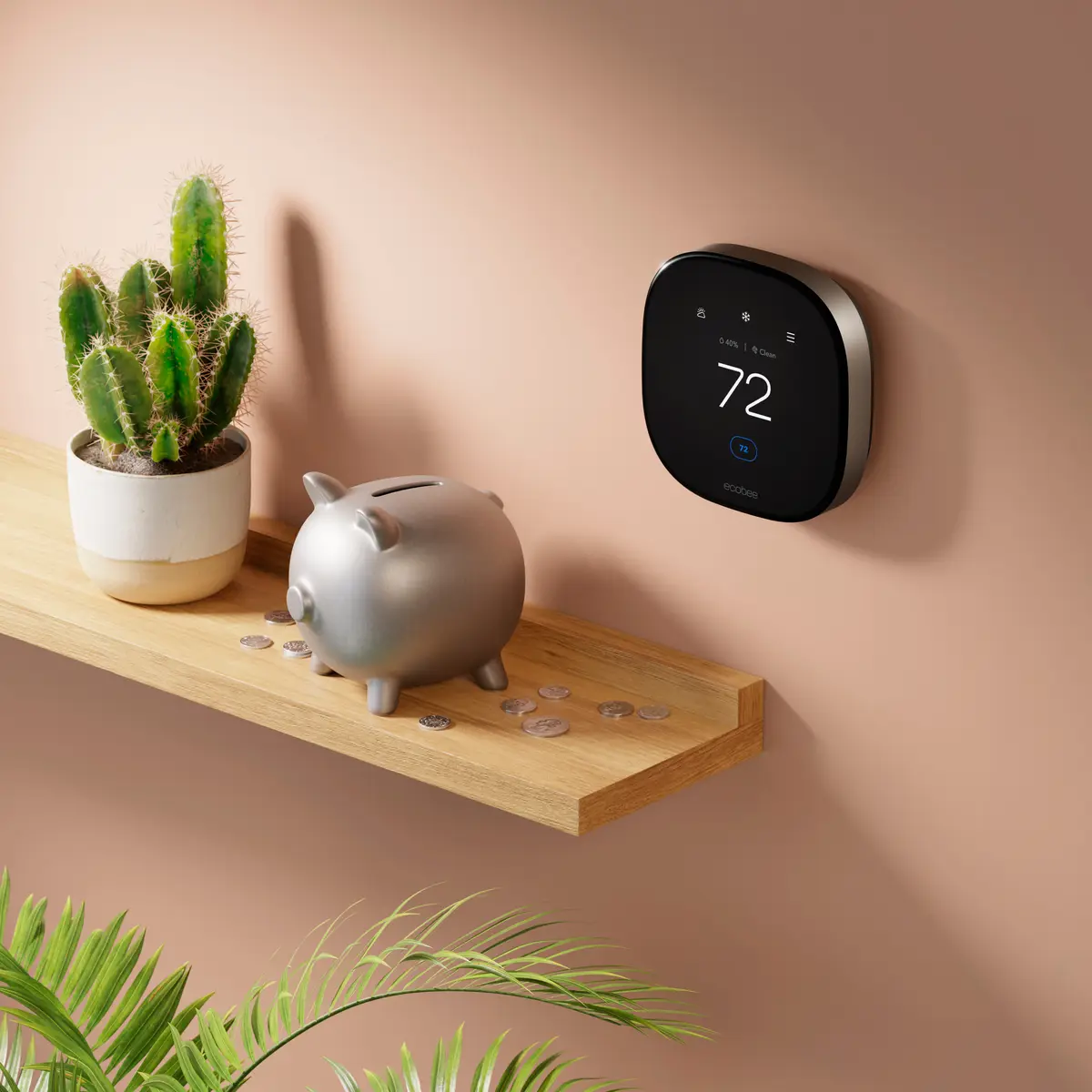 ecobee Smart Thermostat Premium mounted on a wall above a shelf