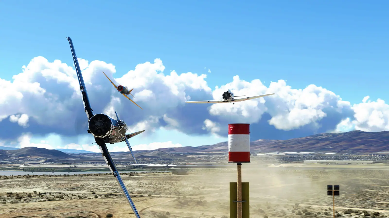 Race planes rounding a pylon above the desert in Microsoft Flight Simulator 2024
