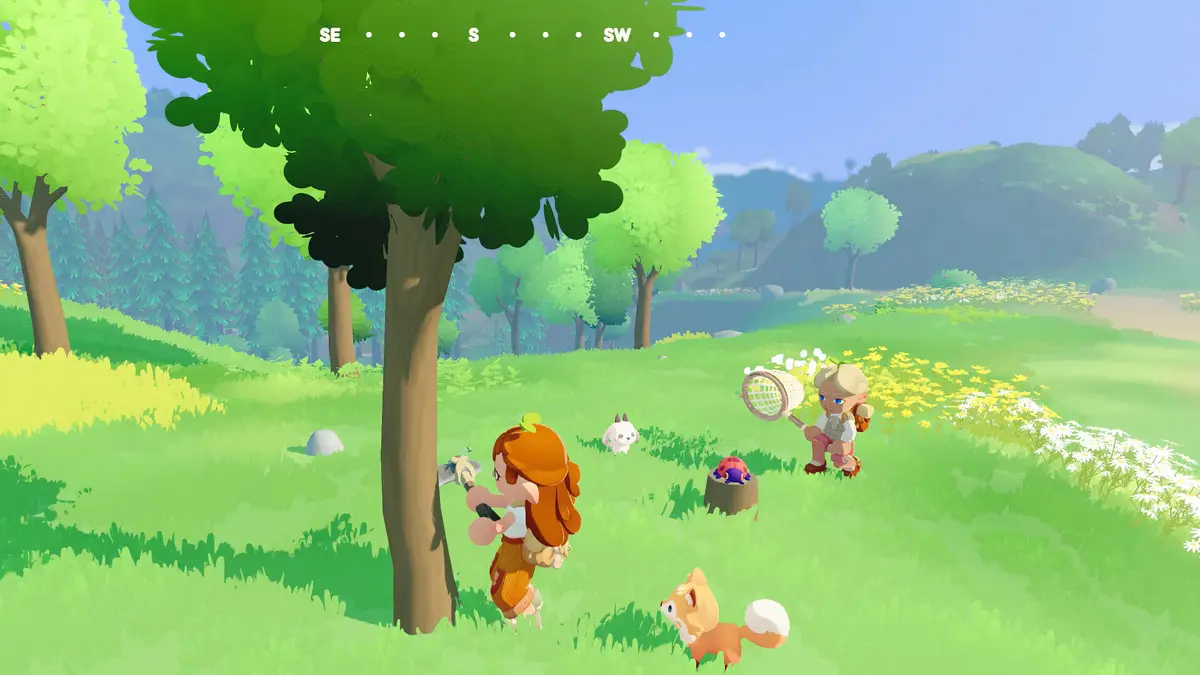A humblet and a fox pet on a sunny meadow in Humblets