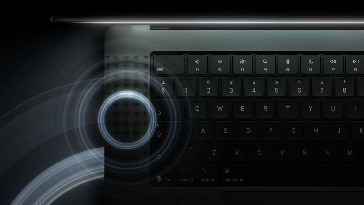 Top view of the MacBook Pro keyboard with sound waves from its six-speaker system