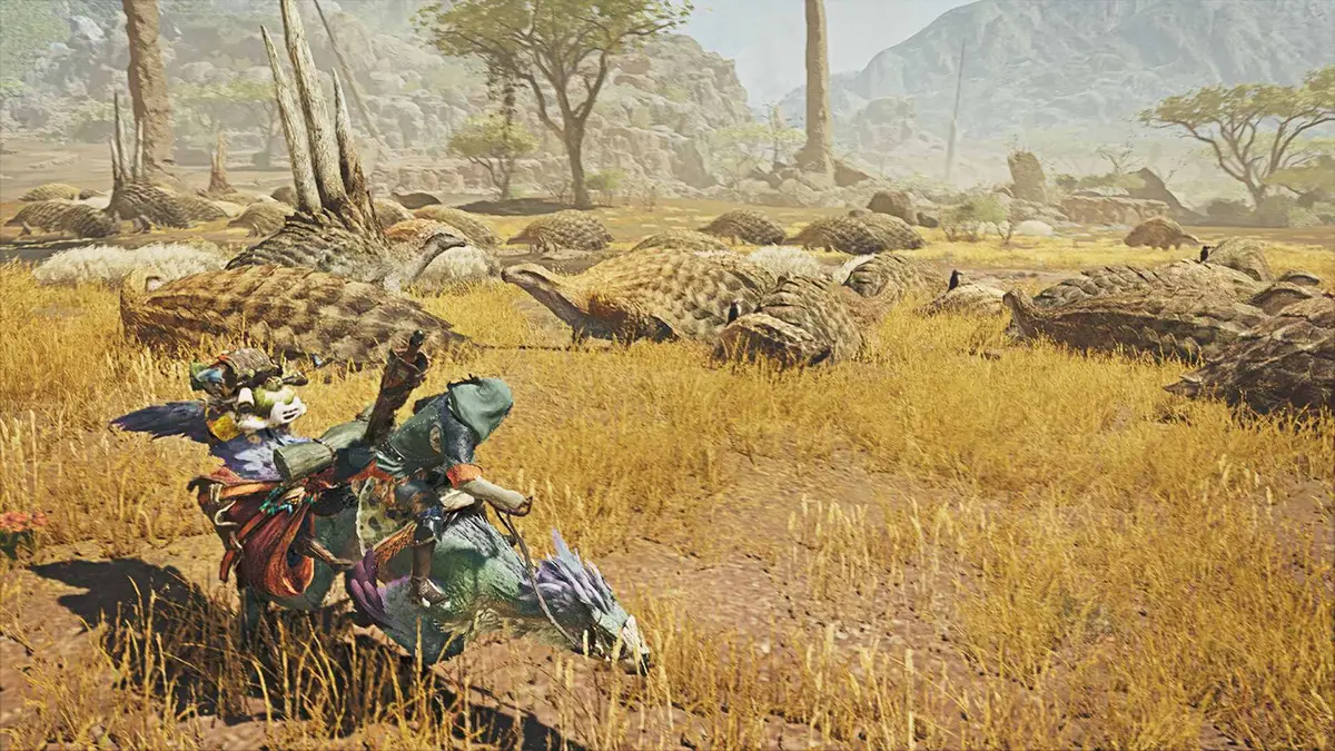 Monster Hunter Wilds에서 탈것을 타고 황금빛 초원을 달리는 헌터