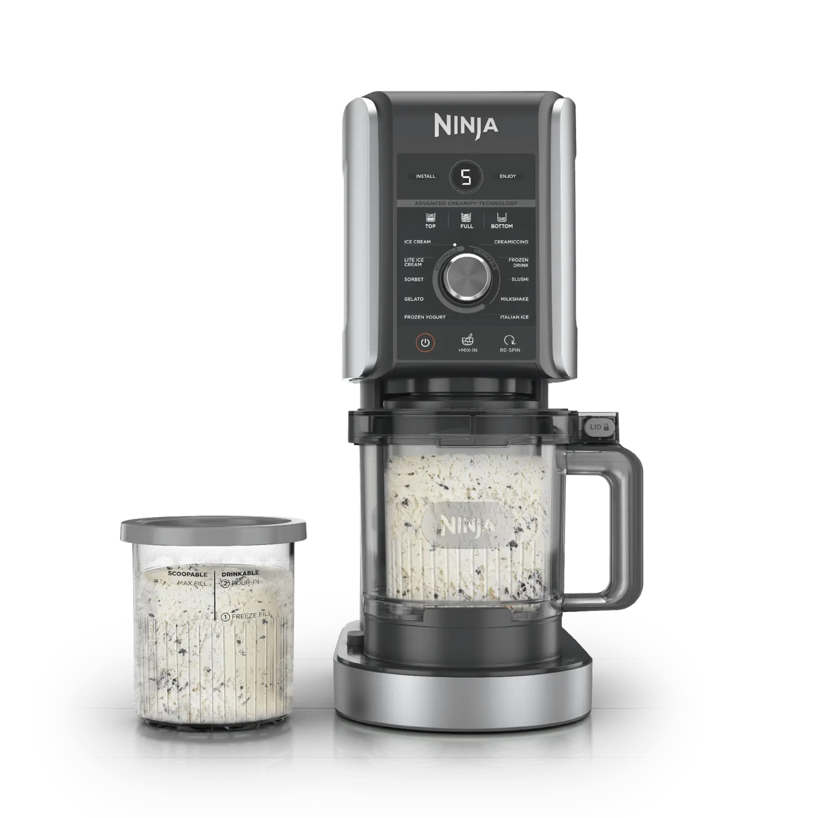 Ninja CREAMi XL Deluxe ice cream maker with a tub of ice cream beside it