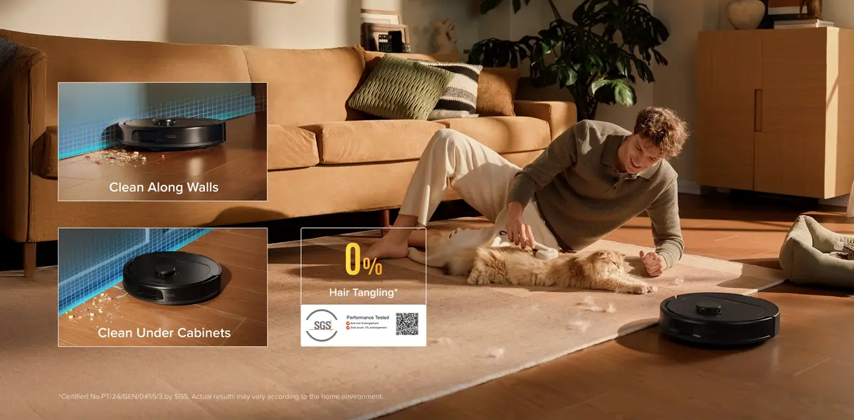 Qrevo S Pro cleaning along a wall and around a cat on a rug