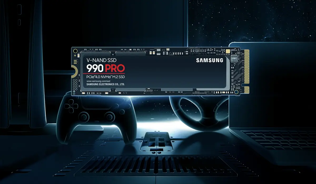 Samsung 990 PRO SSD in a Samsung promotional image with a game console, controller and laptop