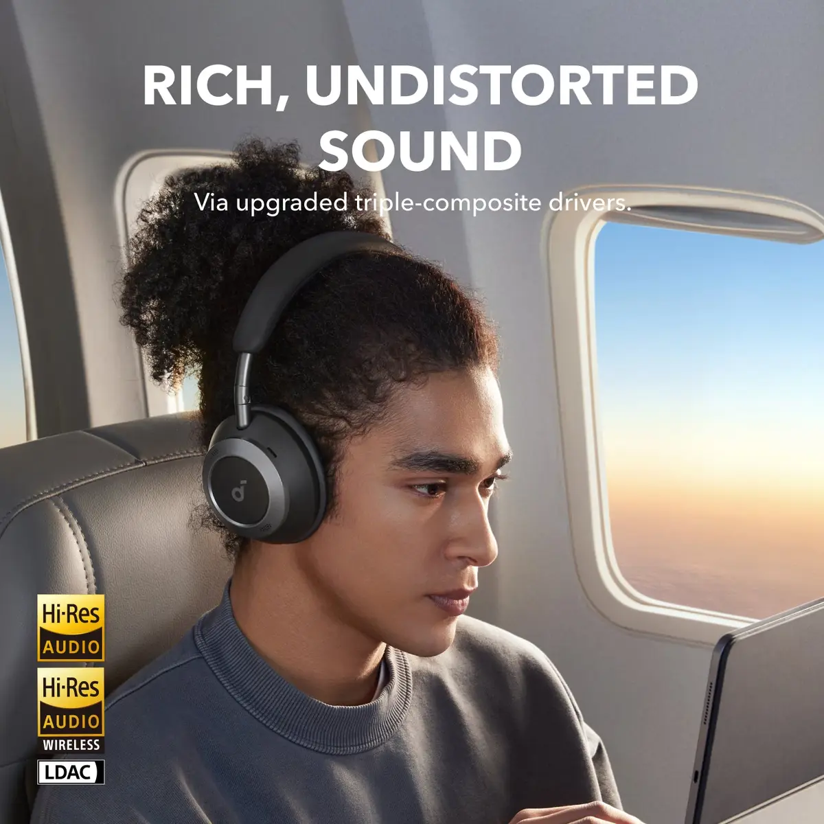 Person wearing the Soundcore Space One Pro on a plane