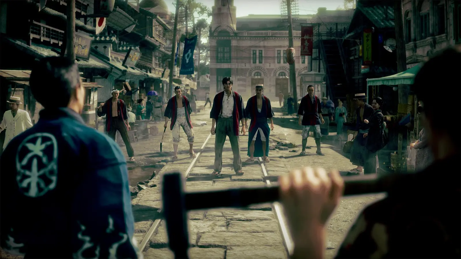 A group of men in early 20th century clothing face off on a street in Stranger Than Heaven