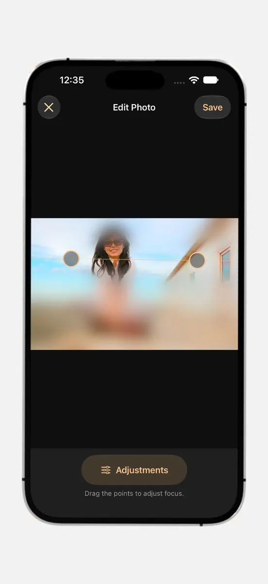 Edit Photo screen with a portrait blurred above and below a sharp band and two focus handles