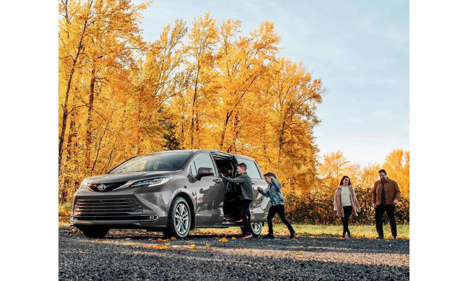 Family minivan parked in a driveway