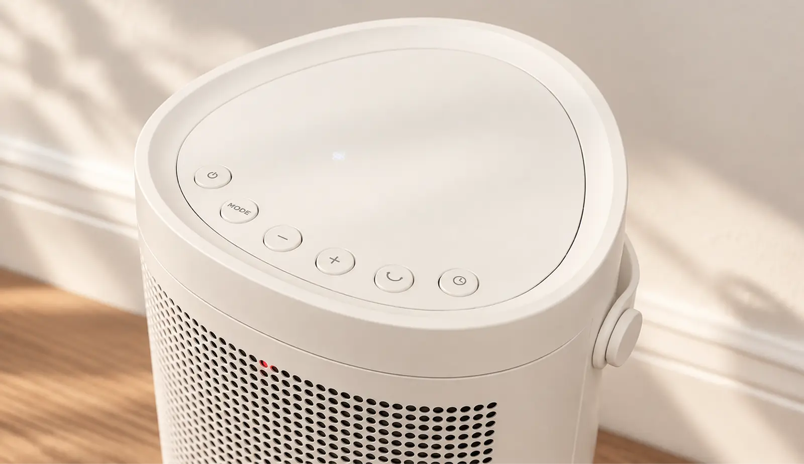 Top of the white Windmill Space Heater with its touch controls and carry handle